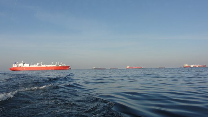 Red and white oil tanker anchored off Fujairah