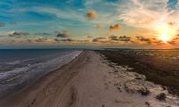 An aerial view of Matagorda Bay at sunset