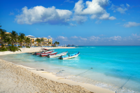 boats looking out to the sea from the Playa Del Carmen beach