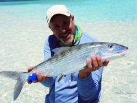 An angler holding a Bonefish he caught while fishing the flats in the Bahamas