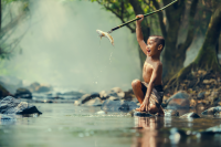 a boy with his spearfishing catch