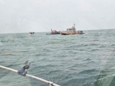 A view of multiple boats on the water, with unclear details and no visible fishing activity.