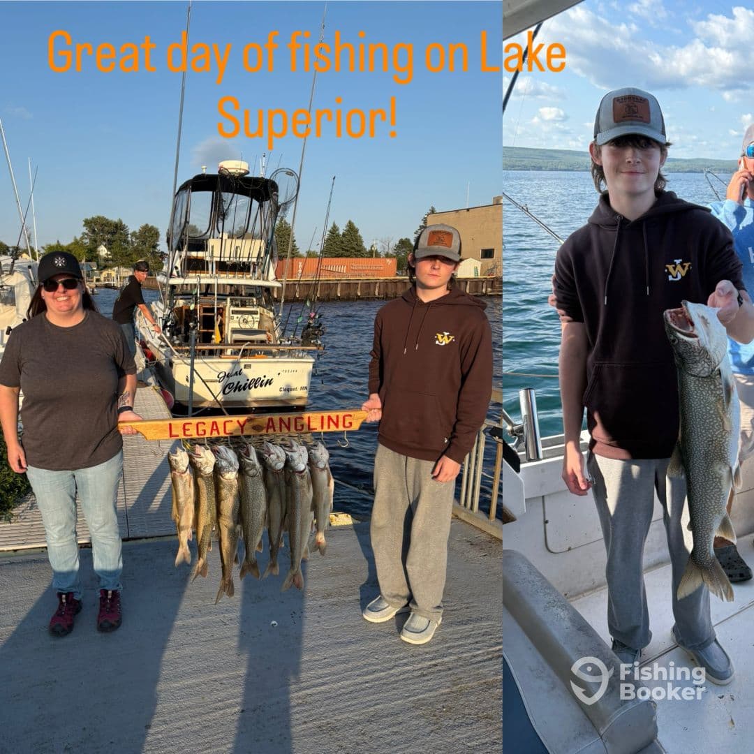 A successful fishing trip on Lake Superior featuring a mother and son proudly displaying their catch of Walleye, with a boat in the background.