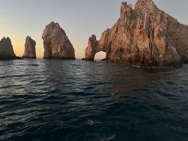 Scenic view of rock formations at sunset, showcasing the natural beauty of the fishing environment.