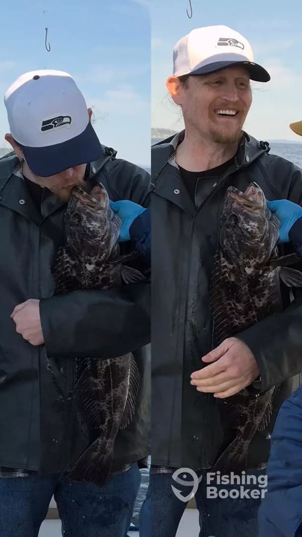 Angler joyfully holding a large rockfish while on a fishing trip, showcasing a proud moment at sea.