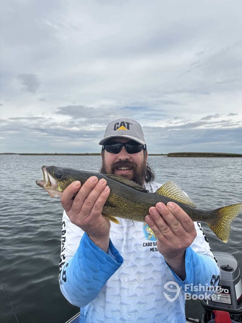 Angler proudly displaying a Walleye caught during a fishing trip in Cabo San Lucas, Mexico.