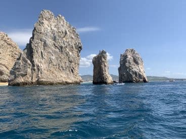 Scenic view of the iconic rock formations at Land's End in Cabo San Lucas, showcasing the stunning coastal landscape and clear blue waters.