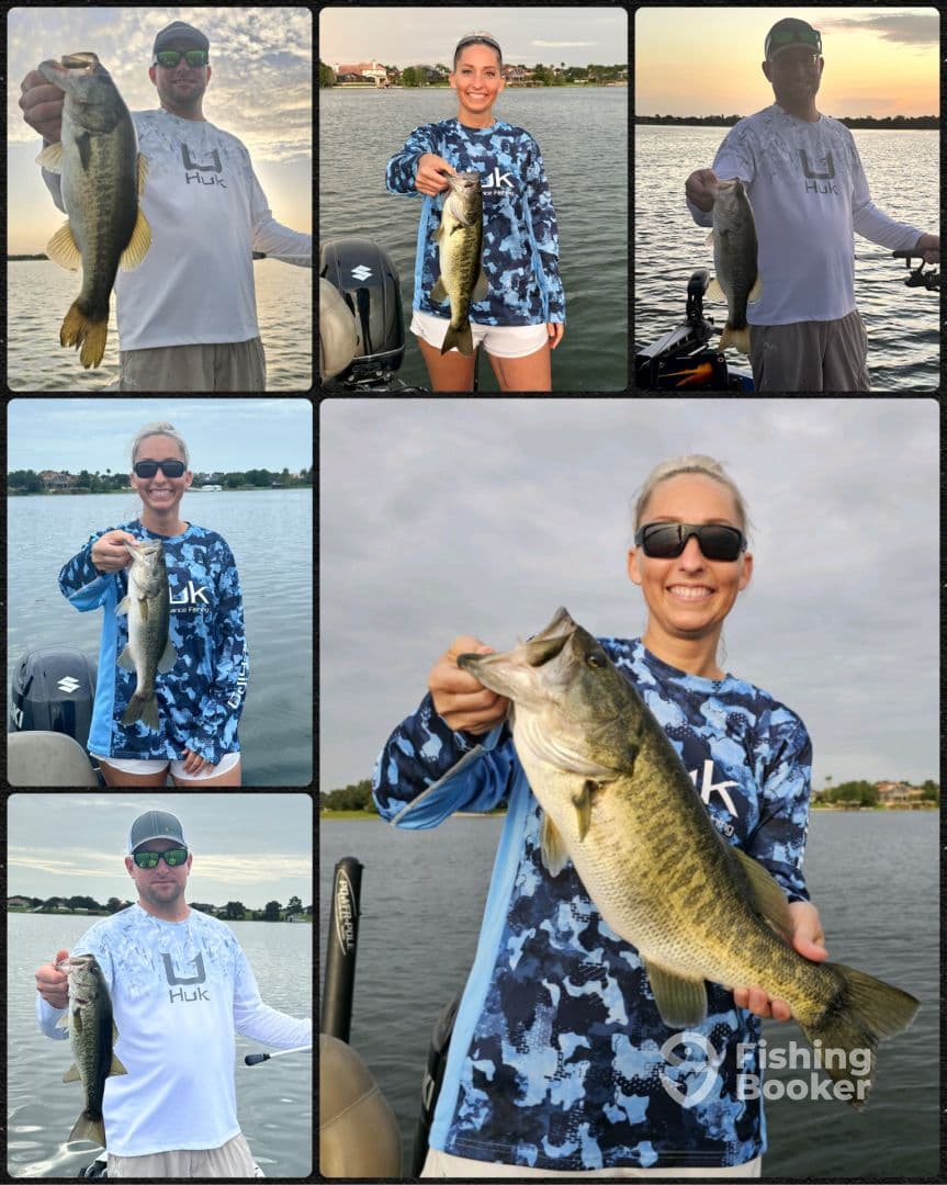 Two anglers proudly displaying their catches of Largemouth Bass while fishing on a serene lake, showcasing their vibrant fishing attire.