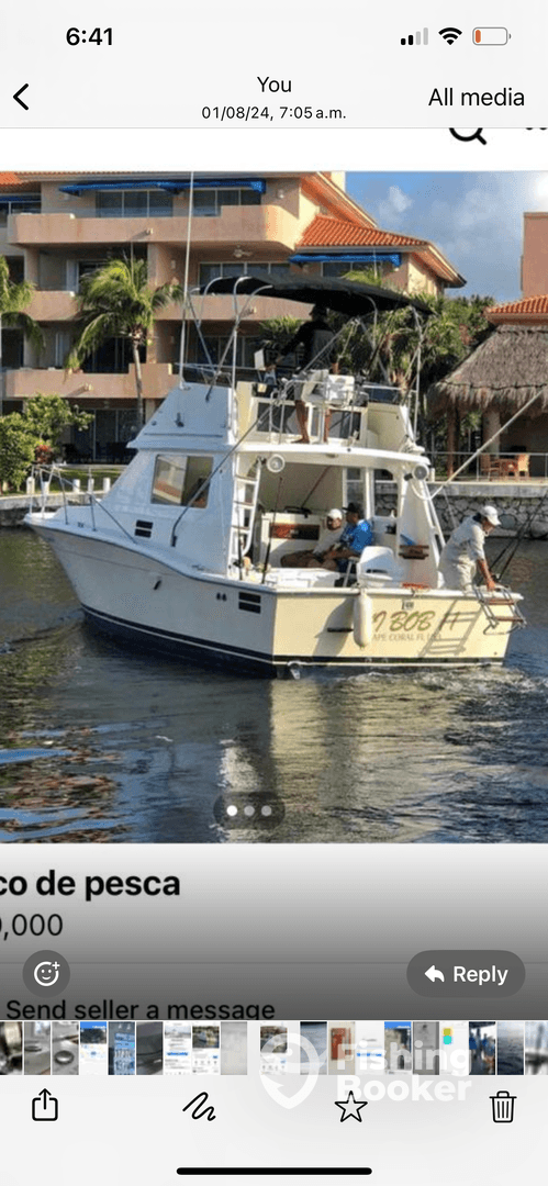 A well-maintained fishing boat navigating through calm waters, showcasing its exterior design and features.