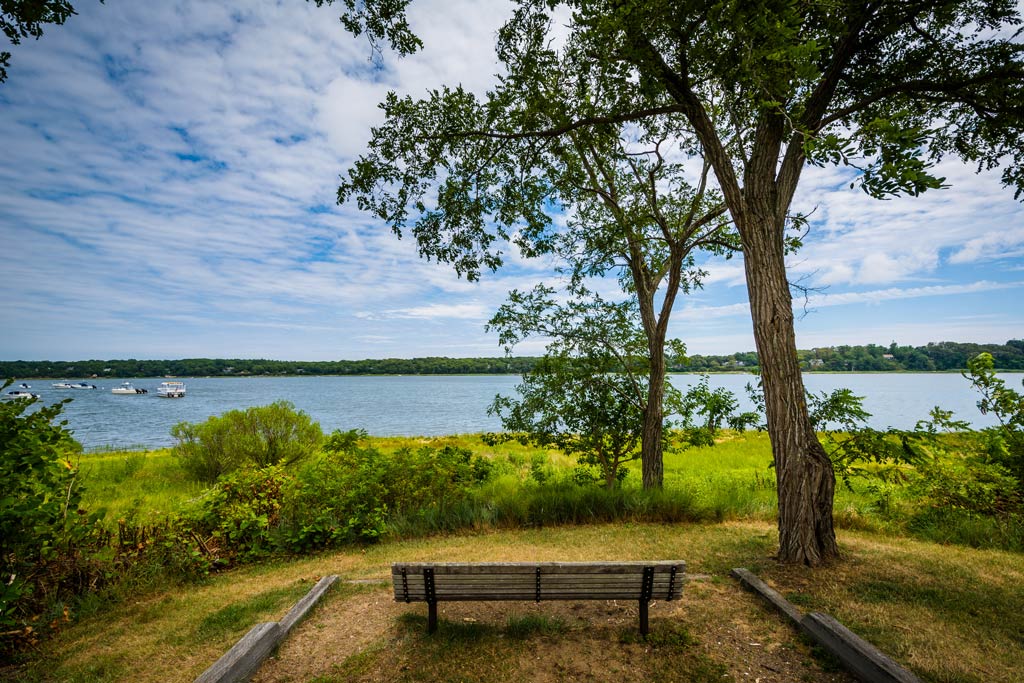 A photo of a bench with a view of the waters in Orleans, MA