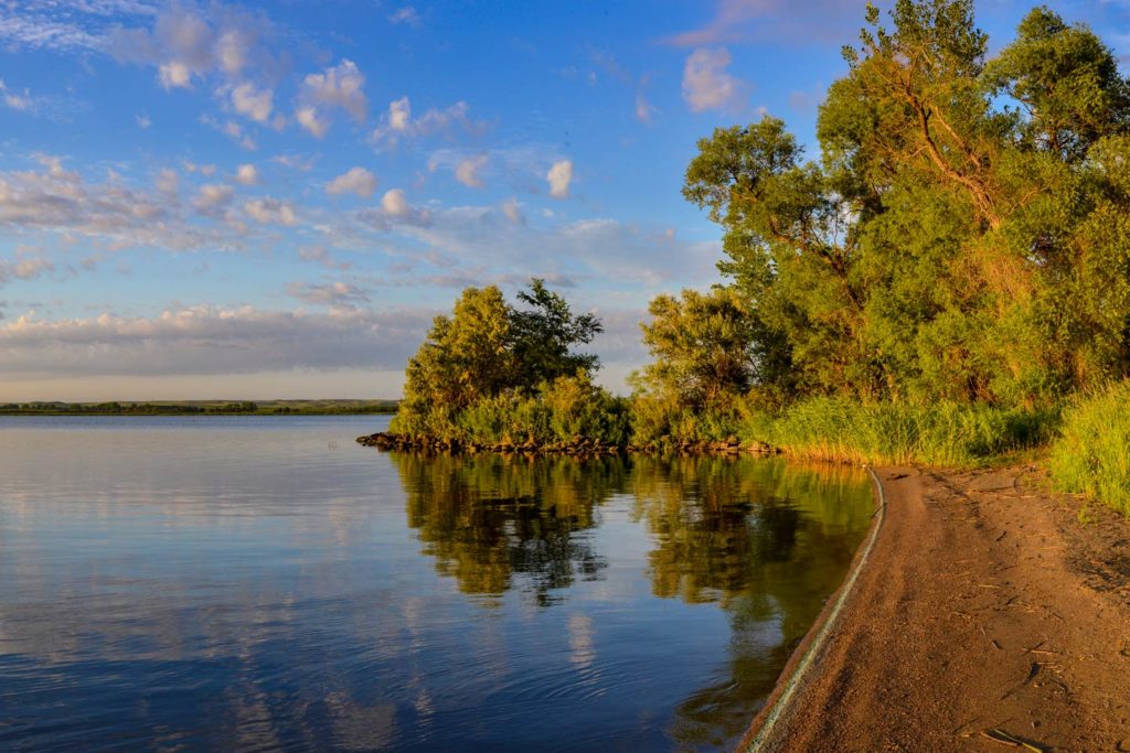 The shorelines of the river in South Dakota, one of the best Fourth of July fishing destinations. 