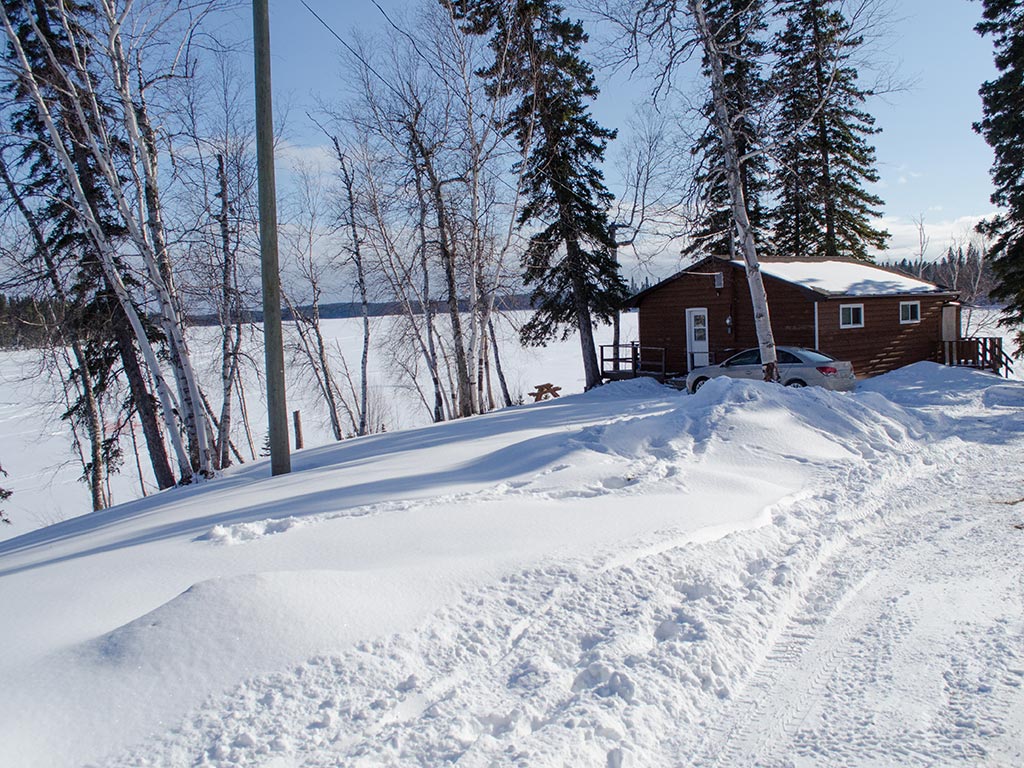 Ice fishing hut near Athapapuskow Lake, Canada.