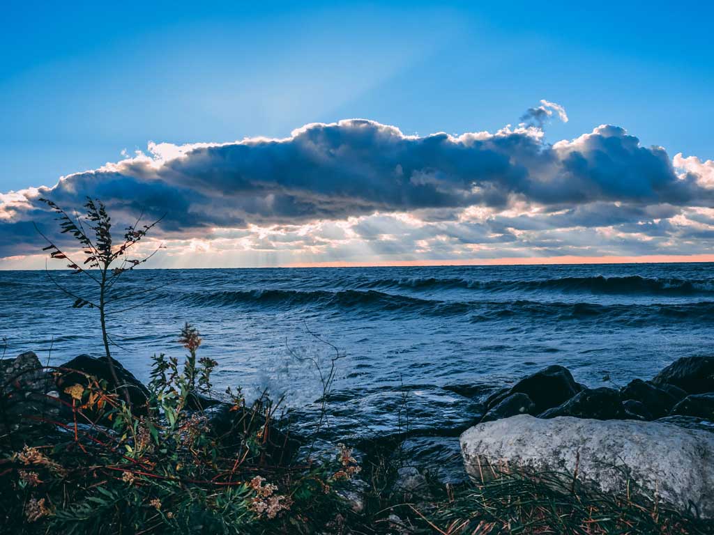 A photo of Lake Erie from the Canadian side, with rolling waves and beautiful clouds.