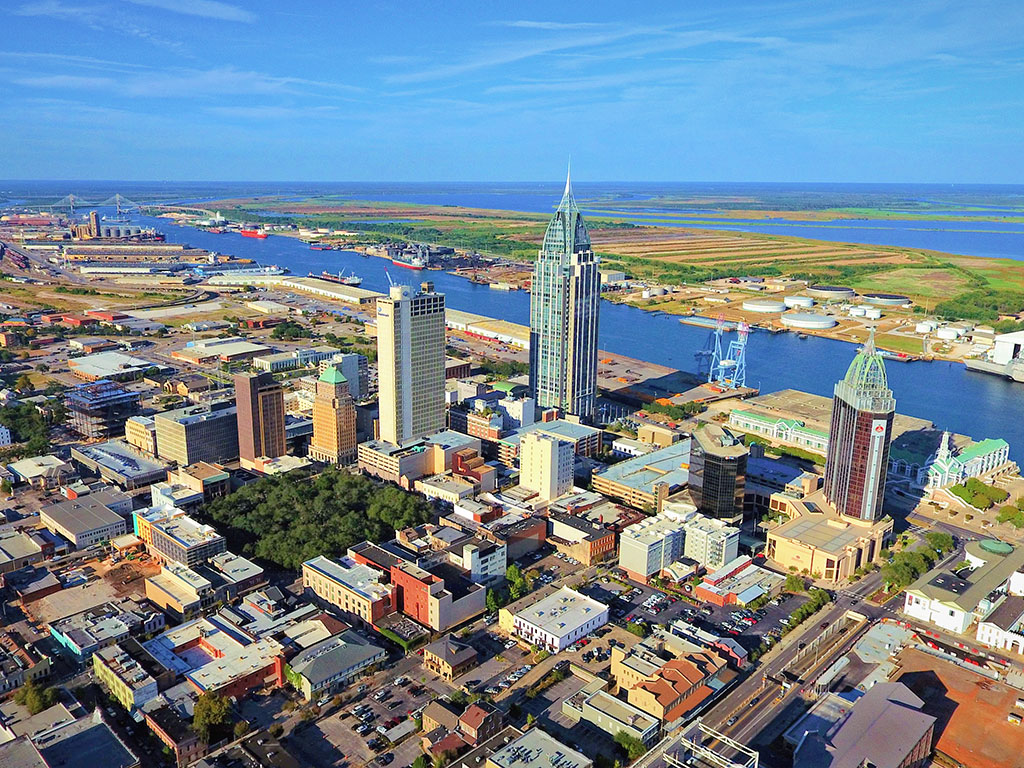 An aerial view of Mobile, Alabama, with the river behind downtown