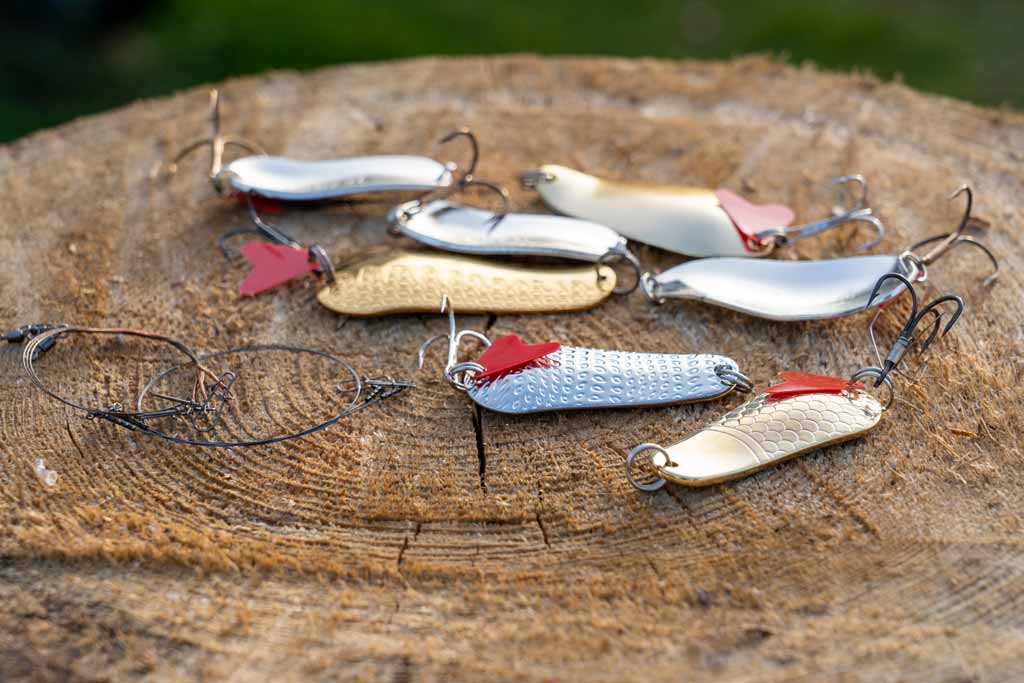 An assortment of spoon lures for river fishing