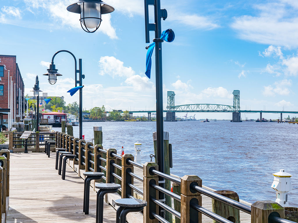 A view of the bridge in Wilmington, NC, with the famous riverwalk in the left of the picture