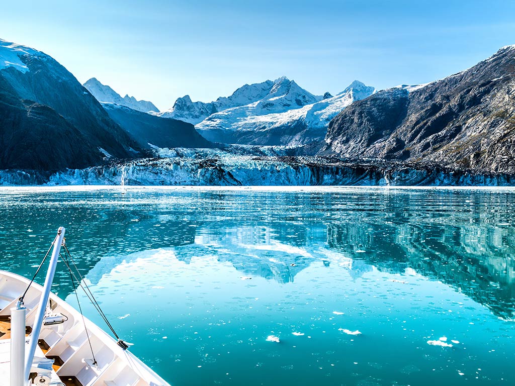 Glacier Bay, Alaska, as seen from a boat on a sunny day.