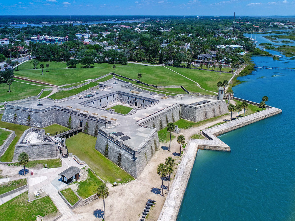 An aerial view of St. Augustine, FL, with the Castillo de San Marcos National Monument in the foreground
