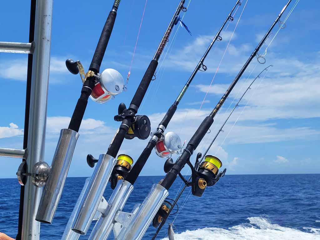 A view of several fishing rods on a Islamorada charter fishing boat