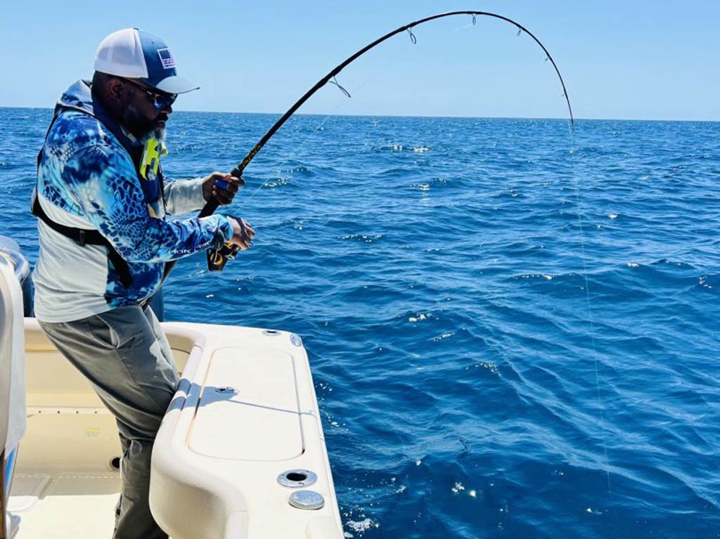 A view of an angler bottom fishing from a boat in Charleston