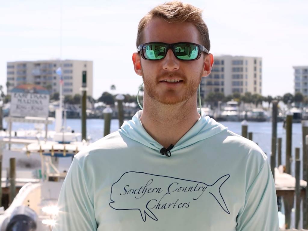 Captain Payton Anderson standing in the marina in Destin, Florida