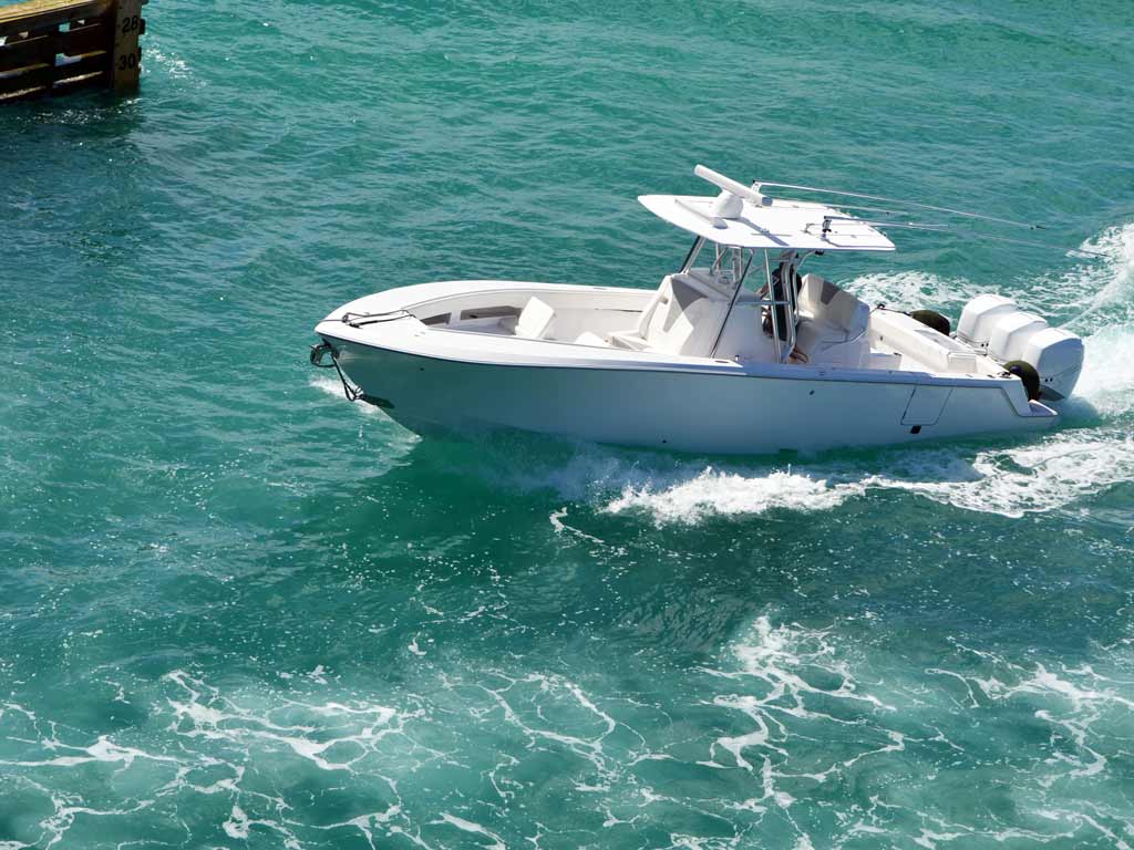 A photo of a center console boat riding through the waters.