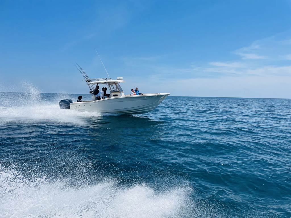 A view of a Charleston charter fishing boat while speed trolling