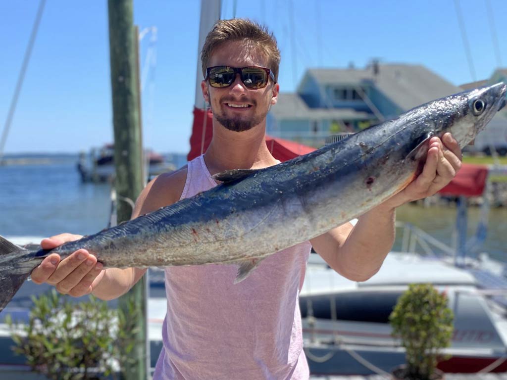 A photo of satisfied angler holding the fish he caught while fishing with Captain Payton on Souther Country Charters boat