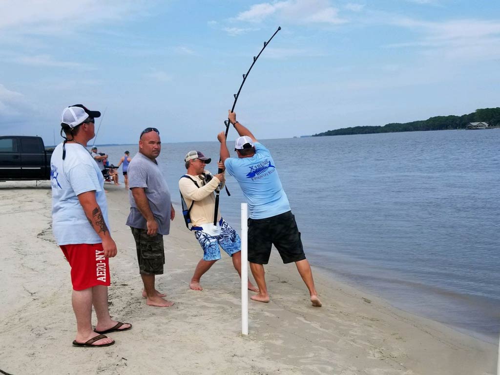 A photo of several anglers surf casting from Jekyll Island beach