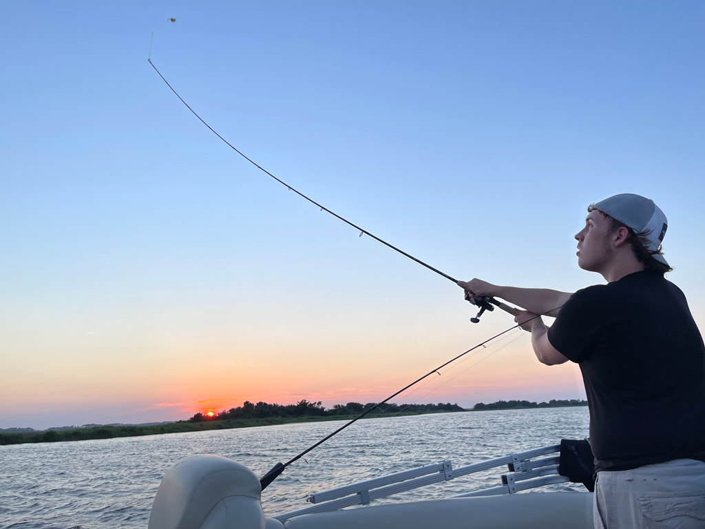 An angler casting from one of the Oregon Inlet charter boats.