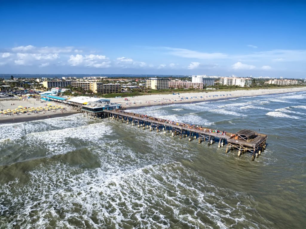 An aerial view of Cocoa Beach Pier on a sunny day, Cape Canaveral, Florida. 