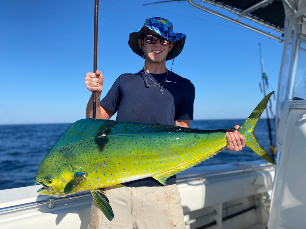 An angler posing with a big Mahi Mahi he reeled in fishing offshore from Ocean City, NJ.