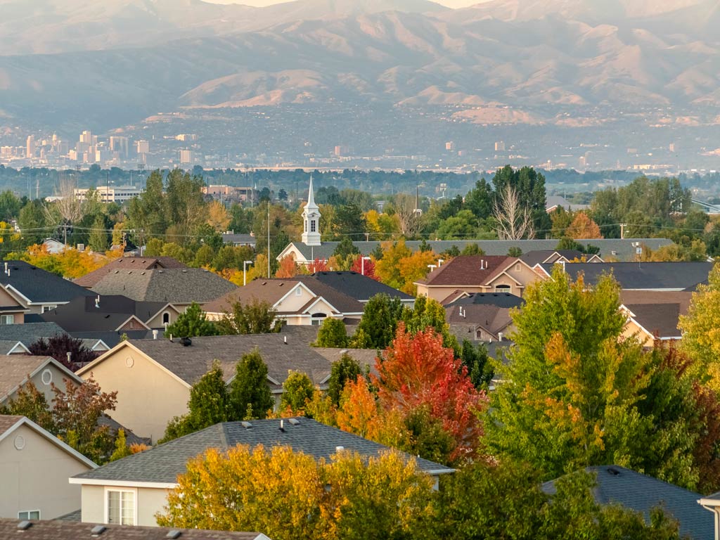 A panoramic view of rooftops in Salt Lake City with mountains in the distance during the Thanksgiving Day