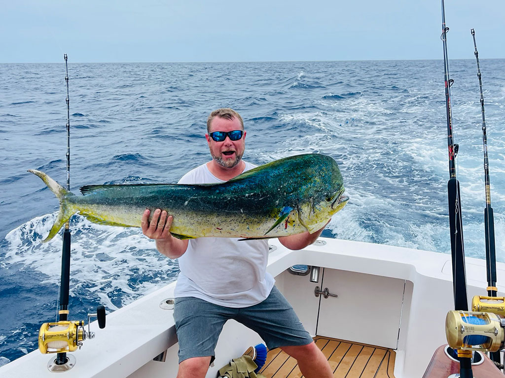 An angler holds a Mahi Mahi he recently caught during an offshore trip into the Gulf Stream.