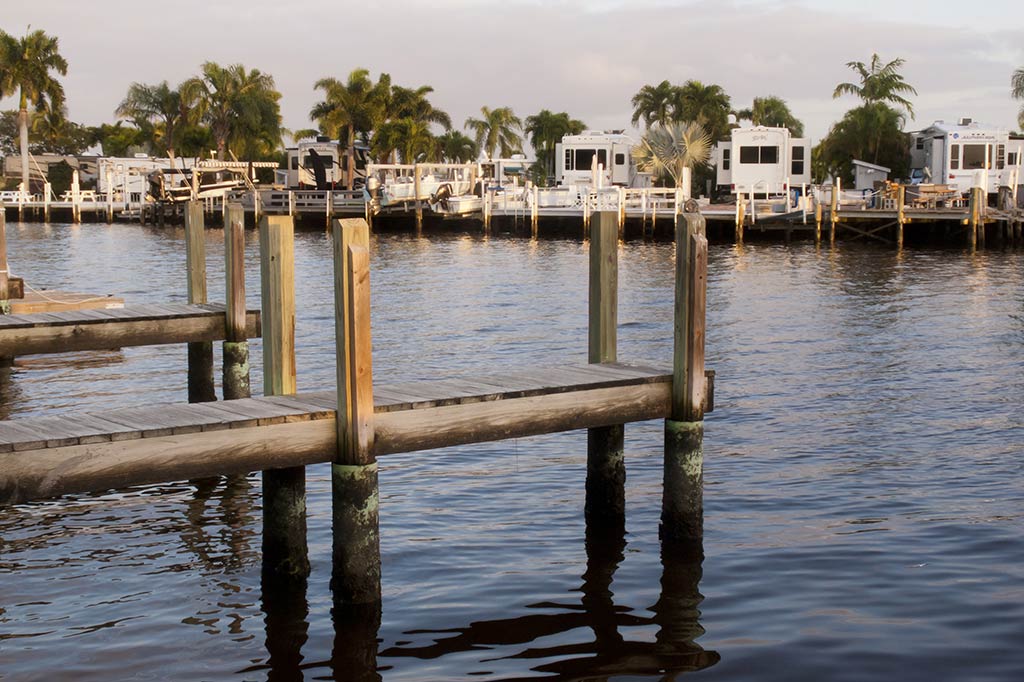 A view of a dock from the waterside on a cloudy day in Chokoloskee