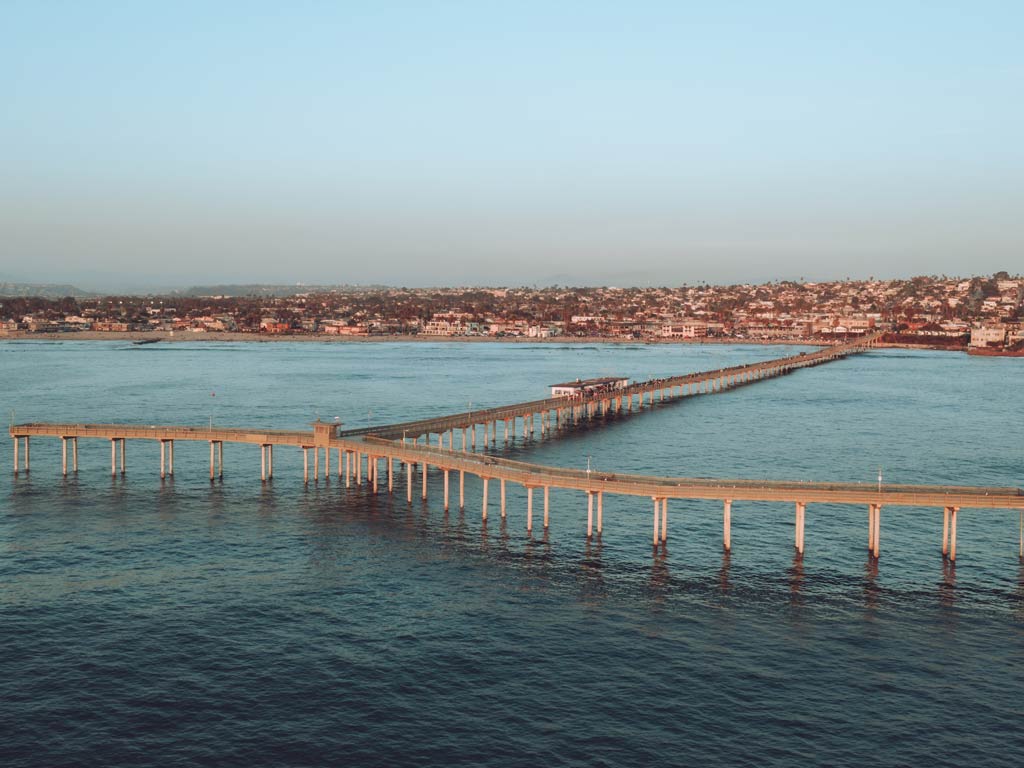 An aerial shot of the Ocean Beach Fishing Pier in Point Loma.