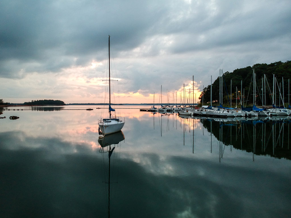 A photo of sailboats at sunset on Lake Hartwell.