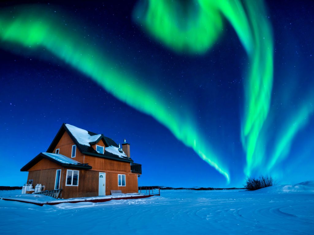 A colorful Aurora Borealis sky over Great Slave Lake in Canada 