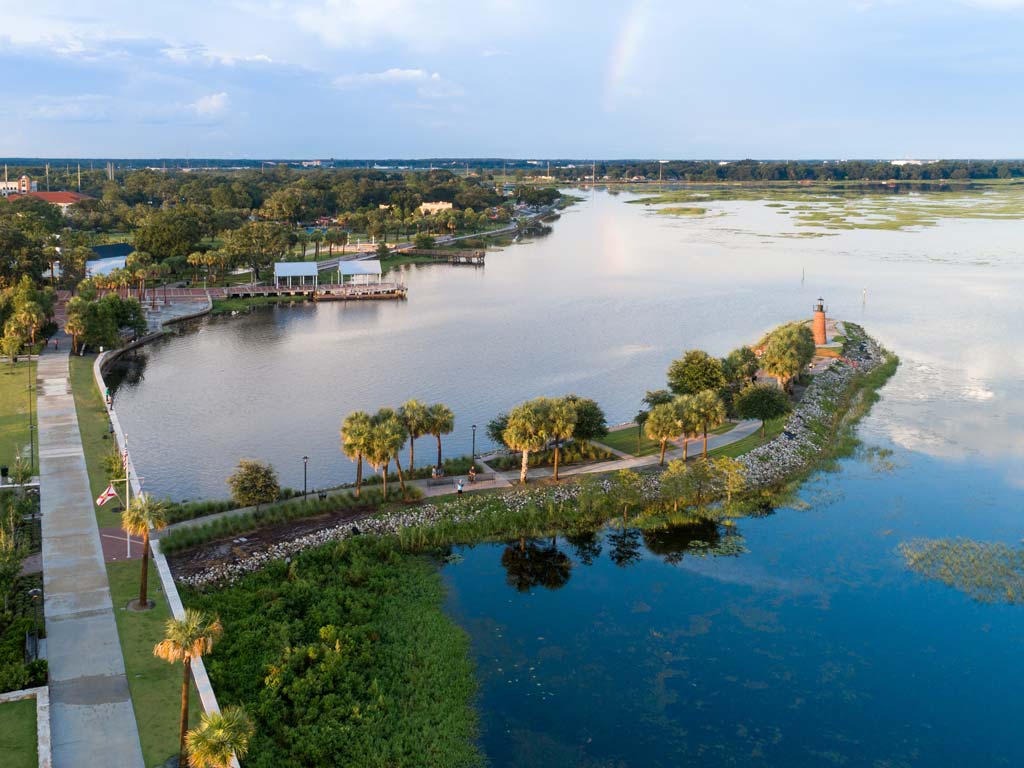 A photo of Lake Kissimmee shores taken from the air on a bright day.