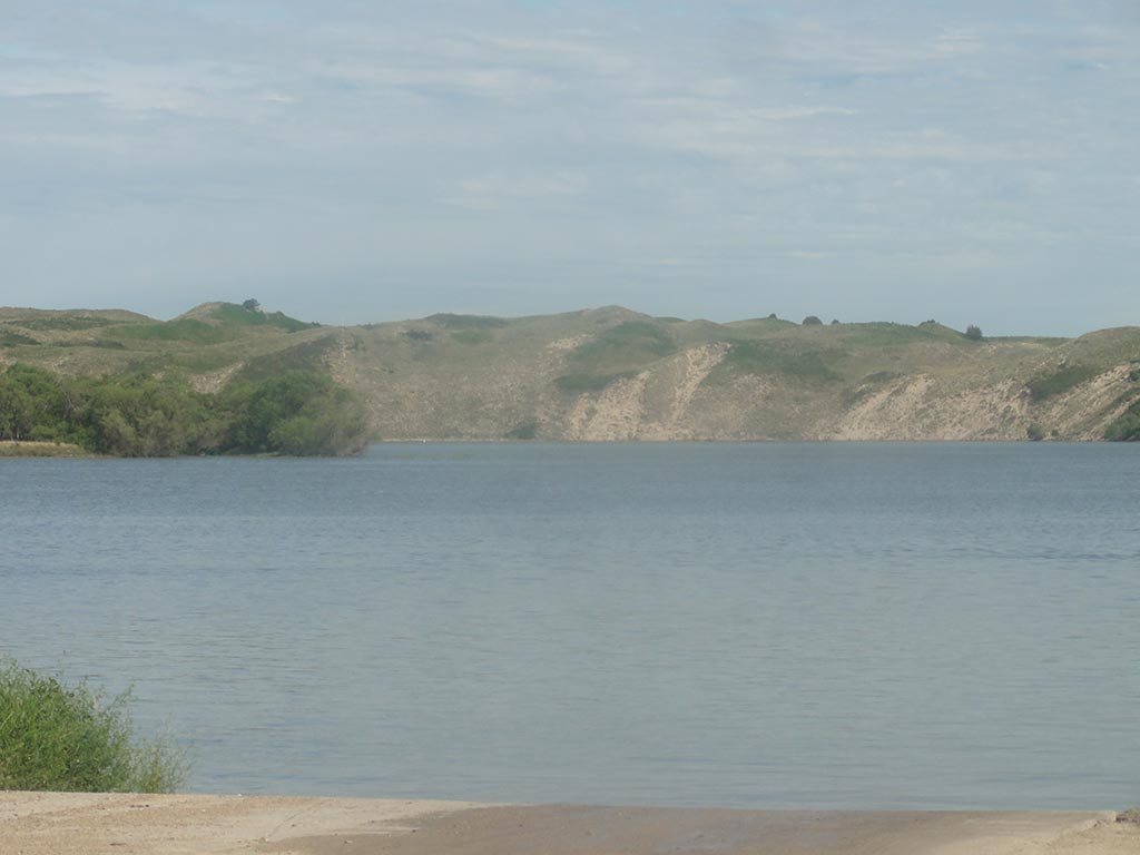 A view of the Merritt Reservoir from the Merritt Dam on a cloudy day.