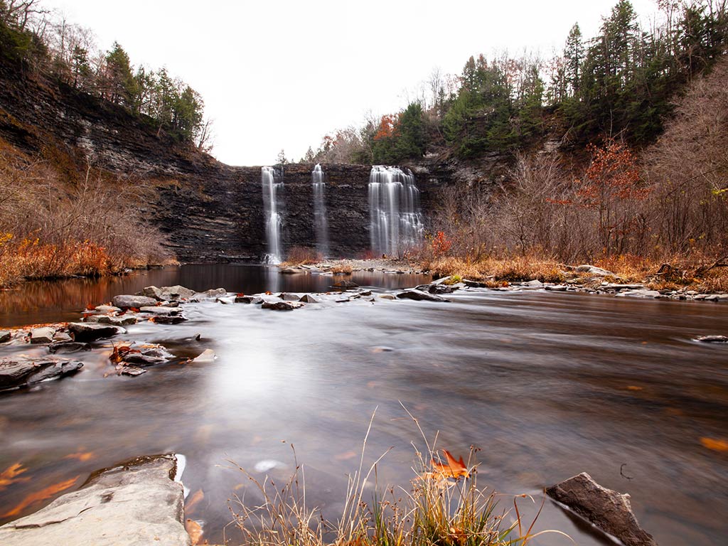 A view of Salmon River Falls on a cloudy day in fall