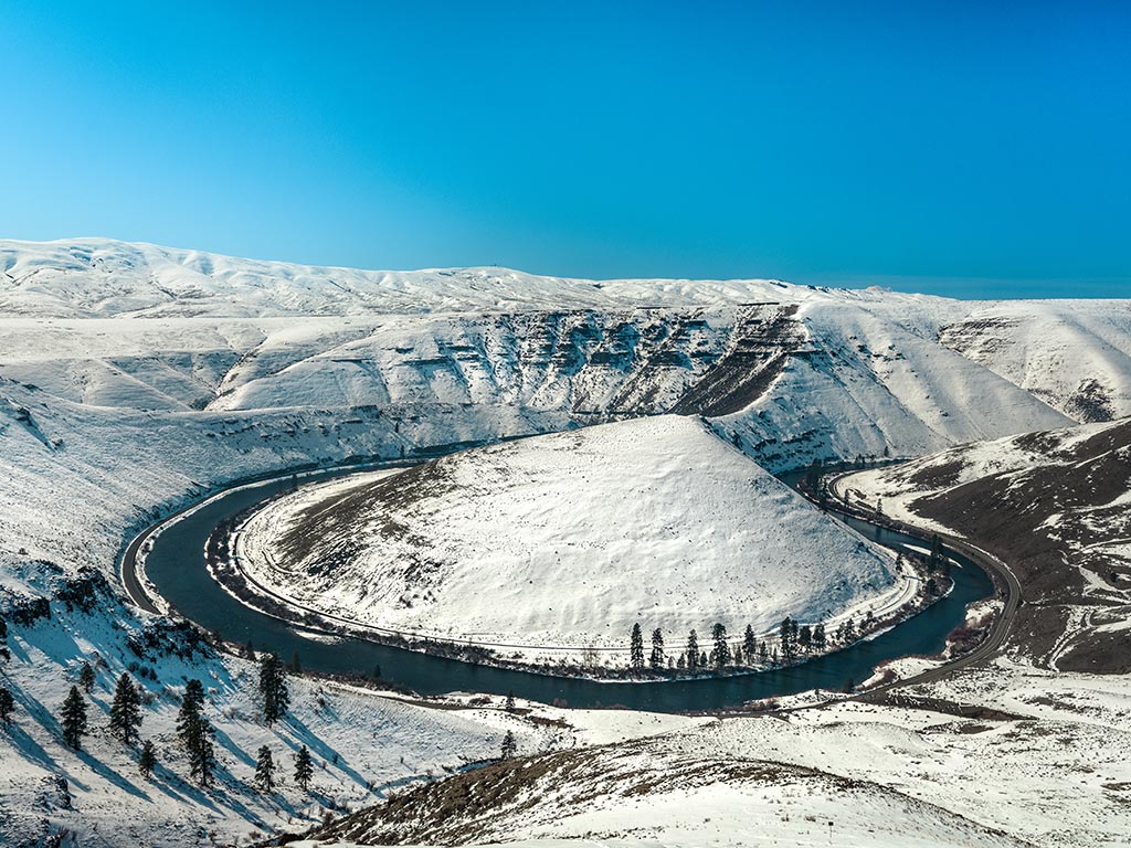 An aerial view of Yakima River canyon during winter after snowfall.