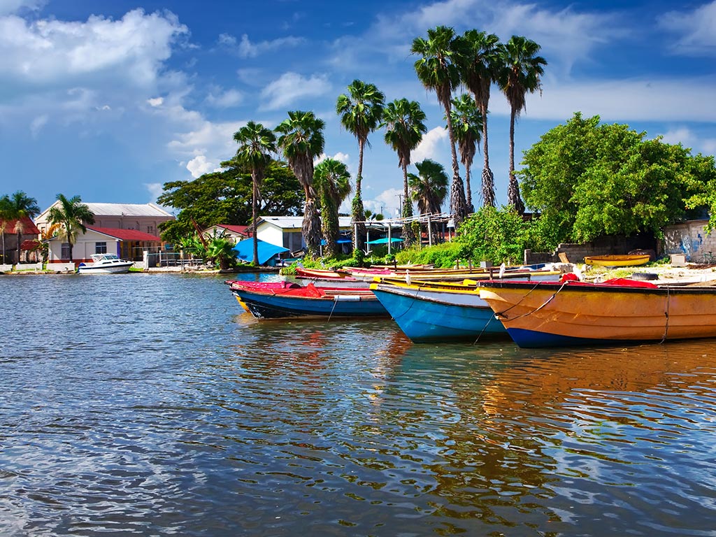 A row of boats on a sunny day somewhere in Jamaica.