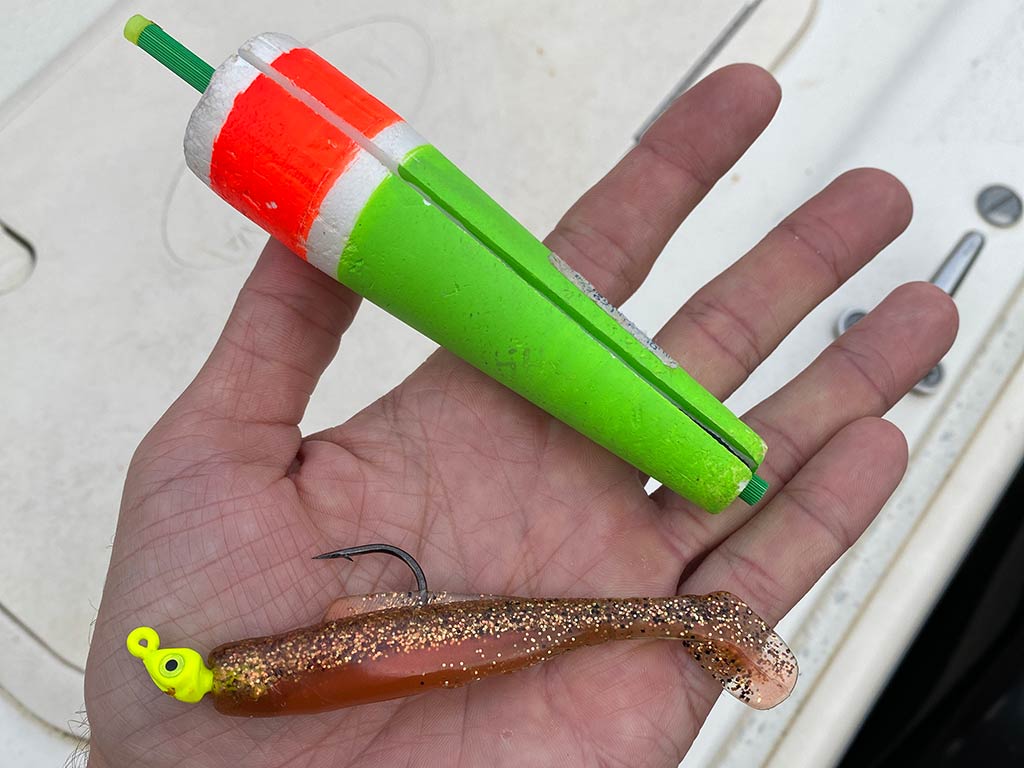 A closeup of a fishing lure used for fishing for Speckled Trout in Texas being held for the camera