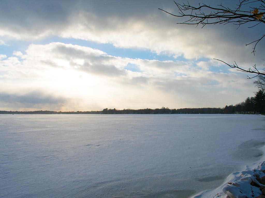 A panoramic view of Lake Mitchell on a cold winter morning