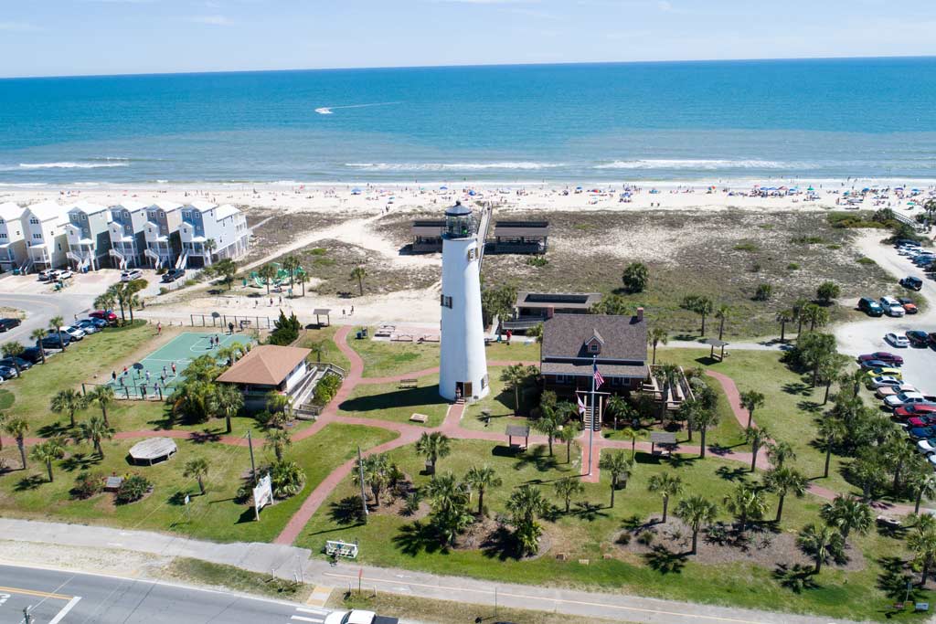 An aerial view of St. George Island, with the beach behind it on a clear day