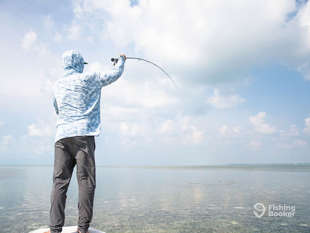 A rearview image of an angler fly fishing in the Florida Keys on a day with sunny intervals