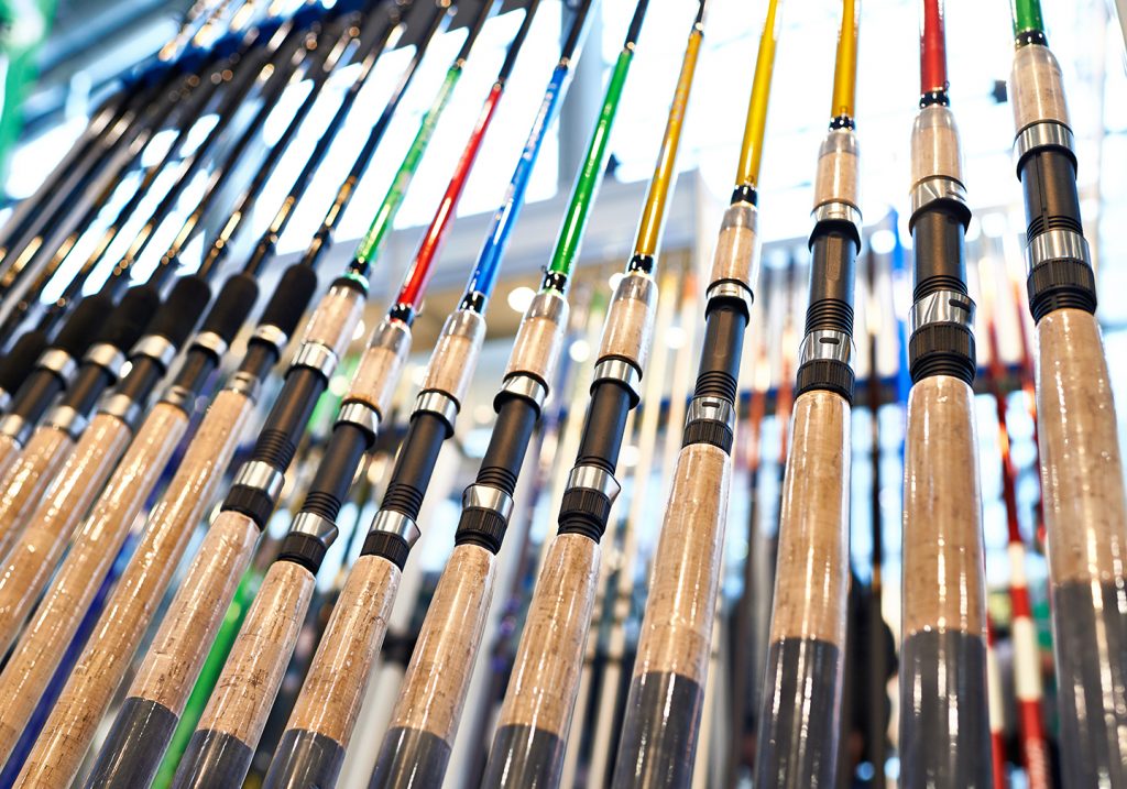 A selection of fishing rods with different colored blanks