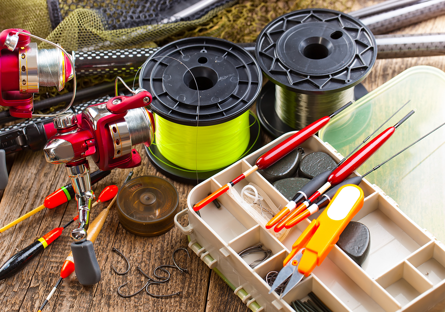 A selection of fishing tackle: fishing line, bobbers, hooks, and more.