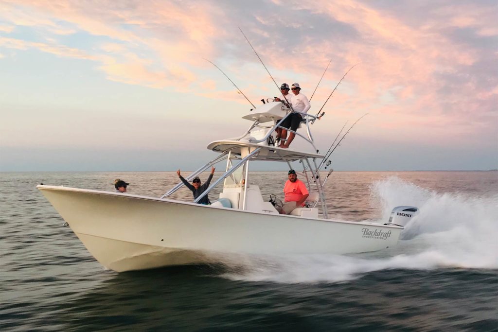 A group of anglers smile for the camera on a large fishing charter heading offshore from Virginia